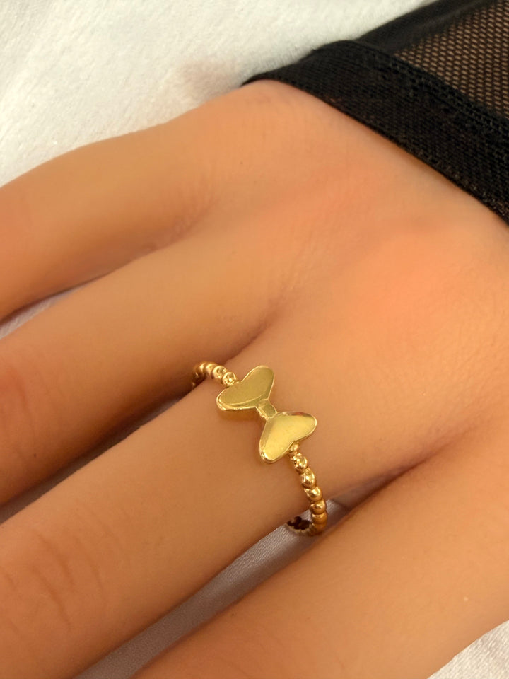 טבעת כדורים מזהב צהוב 14 קראט בעיצוב פפיון מבריק